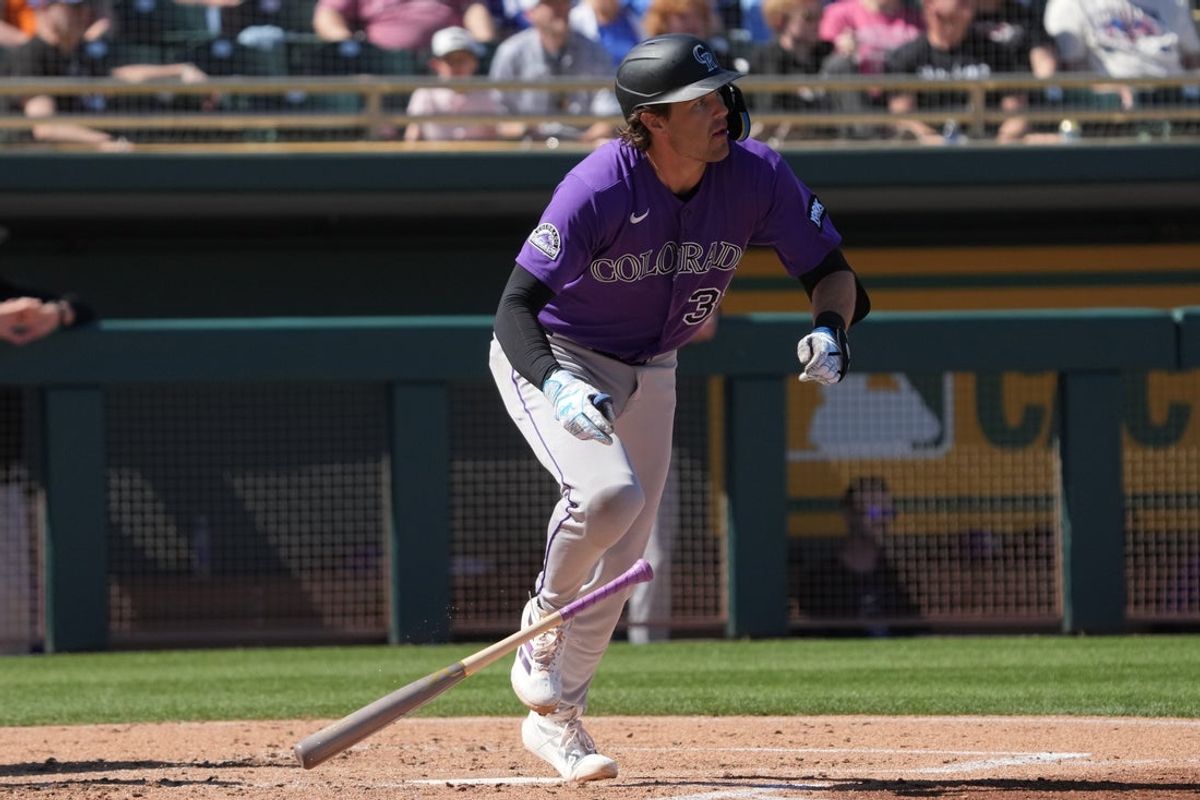 Mar 6, 2026; Mesa, Arizona, USA; Colorado Rockies shortstop Chad Stevens (39) hits a solo home run against the Athletics in the second inning at Hohokam Stadium. Mandatory Credit: Rick Scuteri-Imagn Images