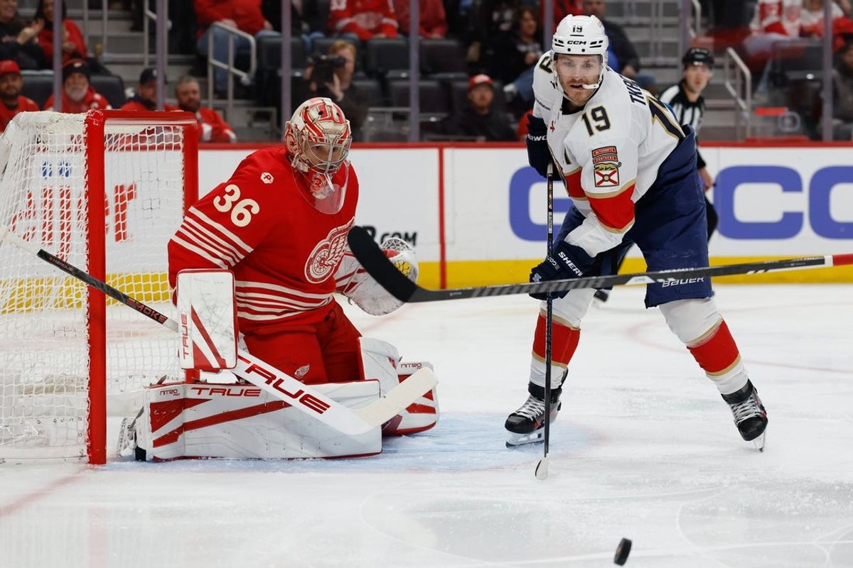 Mar 6, 2026; Detroit, Michigan, USA;  Florida Panthers left wing Matthew Tkachuk (19) looks for a rebound in front of Detroit Red Wings goaltender John Gibson (36) in the first period at Little Caesars Arena. Mandatory Credit: Rick Osentoski-Imagn Images