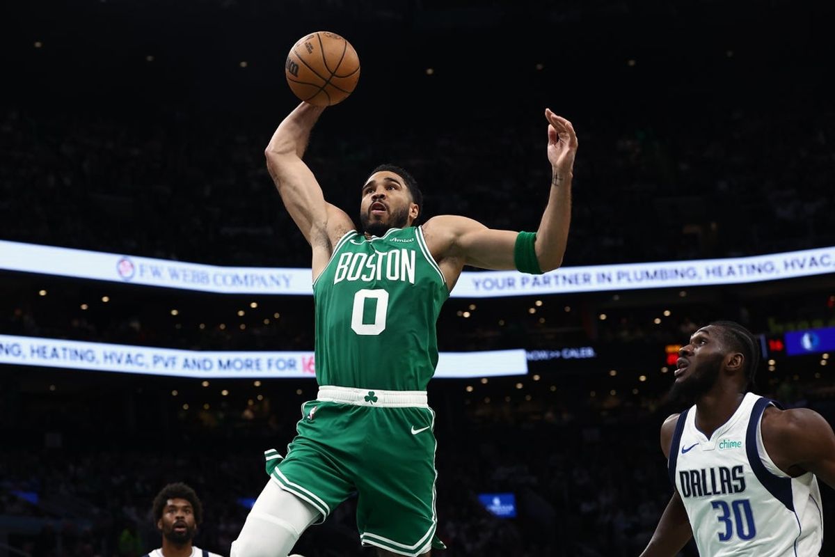 Mar 6, 2026; Boston, Massachusetts, USA; Boston Celtics forward Jayson Tatum (0) goes to the basket past Dallas Mavericks center Moussa Cisse (30) during the second quarter at TD Garden. Mandatory Credit: Winslow Townson-Imagn Images