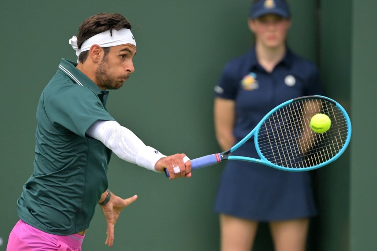 Mar 6, 2026; Indian Wells, CA, USA;  Lorenzo Musetti (ITA) hits a shot during his second round match against Marton Fucsovics (HUN) in the BNP Paribas Open at the Indian Wells Tennis Garden. Mandatory Credit: Jayne Kamin-Oncea-Imagn Images
