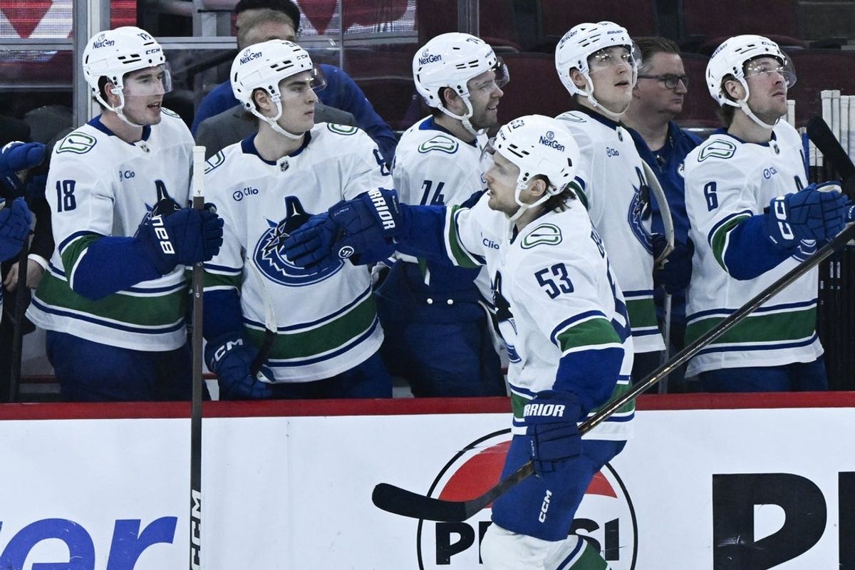 Mar 6, 2026; Chicago, Illinois, USA;  Vancouver Canucks center Teddy Blueger (53) celebrates with teammates after scoring against the Chicago Blackhawks during the first period at United Center. Mandatory Credit: Matt Marton-Imagn Images