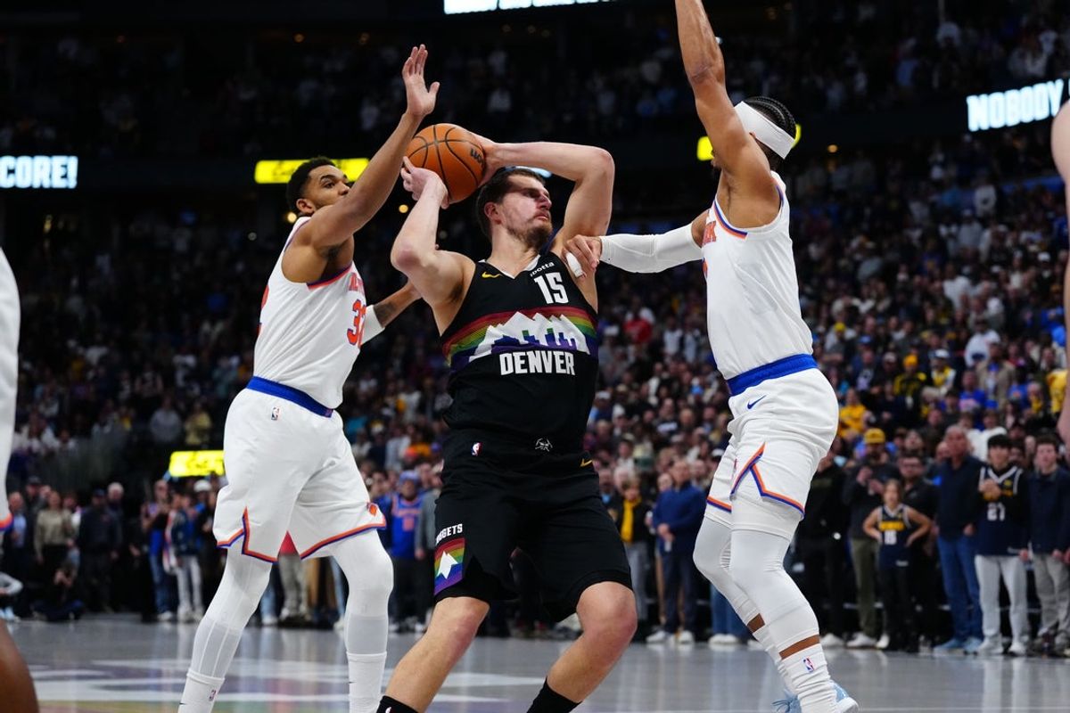 Mar 6, 2026; Denver, Colorado, USA; New York Knicks center Karl-Anthony Towns (32) and New York Knicks guard Josh Hart (3) defend Denver Nuggets center Nikola Jokic (15) in the first quarter at Ball Arena. Mandatory Credit: Ron Chenoy-Imagn Images