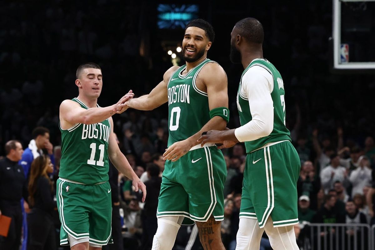 Mar 6, 2026; Boston, Massachusetts, USA; Boston Celtics forward Jayson Tatum (0) smiles at Boston Celtics guard Jaylen Brown (7) while being congratulated by guard Payton Pritchard (11) during the second half at TD Garden. Mandatory Credit: Winslow Townson-Imagn Images