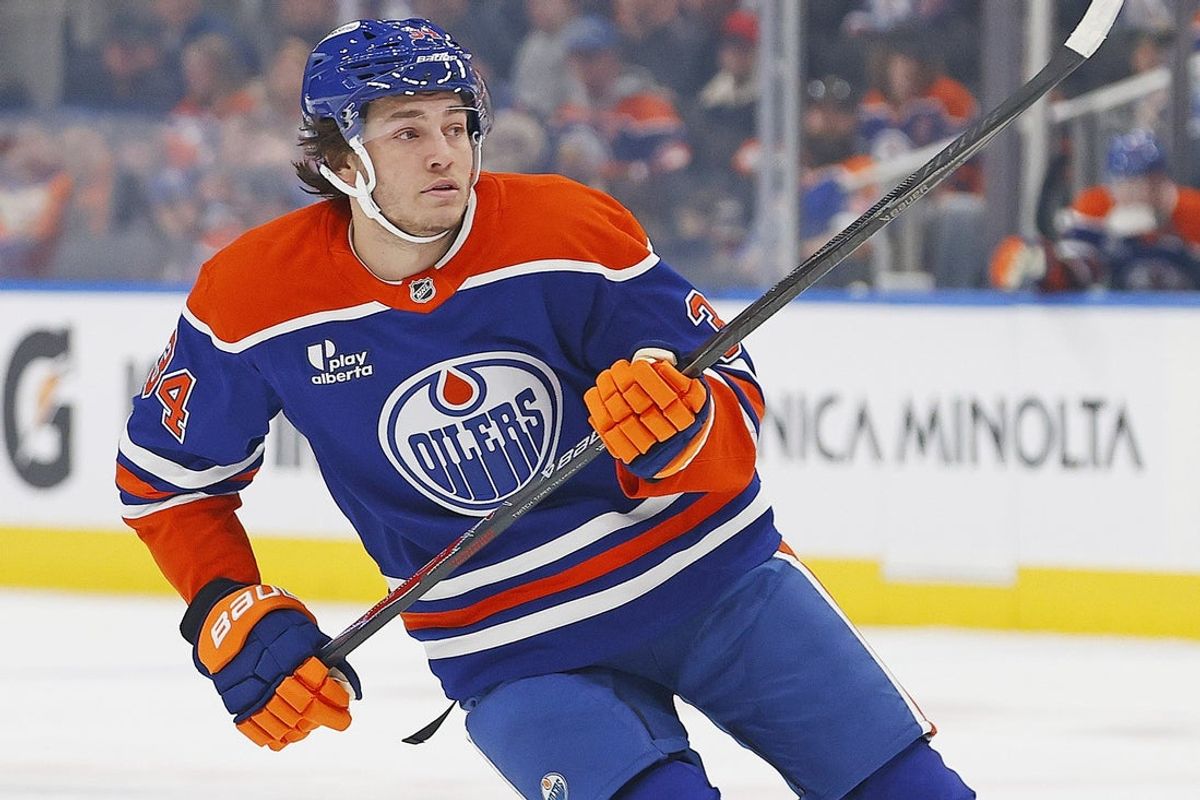 Mar 6, 2026; Edmonton, Alberta, CAN; Edmonton Oilers forward Colton Dach (34) looks for a loose puck during the first period in his first game for the Edmonton Oilers against the Carolina Hurricanes at Rogers Place. Mandatory Credit: Perry Nelson-Imagn Images