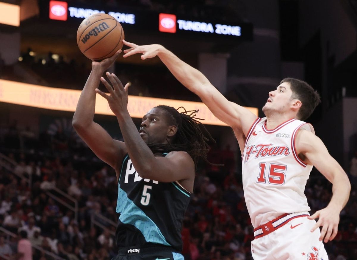 Mar 6, 2026; Houston, Texas, USA;  Portland Trail Blazers guard Jrue Holiday (5) shoots against Houston Rockets guard Reed Sheppard (15) in the second half at Toyota Center. Mandatory Credit: Thomas Shea-Imagn Images