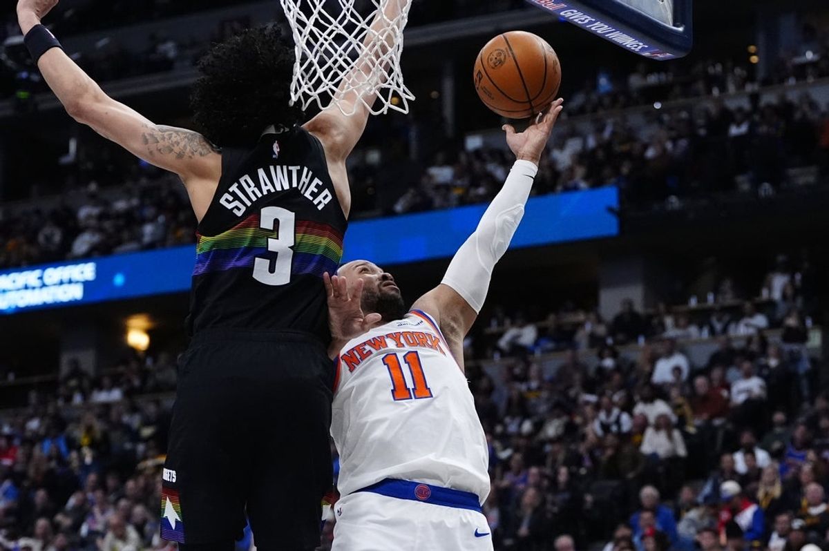 Mar 6, 2026; Denver, Colorado, USA; New York Knicks guard Jalen Brunson (11) shoots the ball against Denver Nuggets guard Julian Strawther (3) in the second half at Ball Arena. Mandatory Credit: Ron Chenoy-Imagn Images