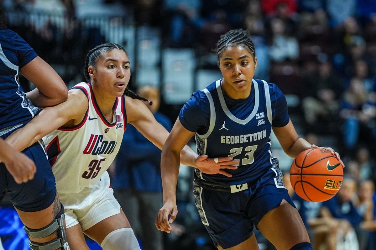 Mar 7, 2026; Uncasville, CT, USA; Georgetown Hoyas guard Summer Davis (23) drives the ball against UConn Huskies guard Azzi Fudd (35) in the fist half at Mohegan Sun Arena. Mandatory Credit: David Butler II-Imagn Images