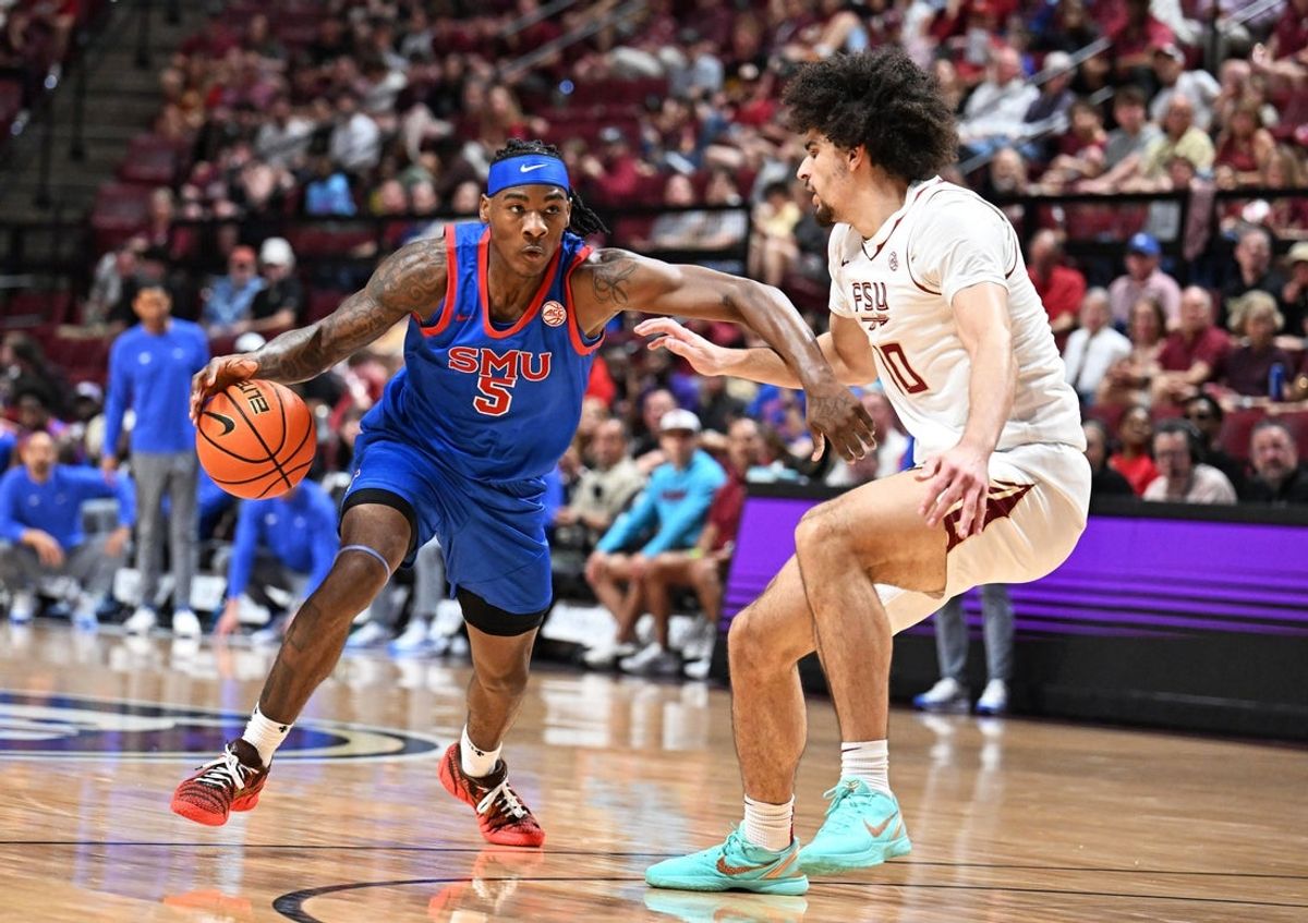 Mar 7, 2026; Tallahassee, Florida, USA; Southern Methodist Mustangs guard Jaron Pierre Jr. (5) drives to the net past Florida State Seminoles guard Lajae Jones (10) during the first half at Donald L. Tucker Center. Mandatory Credit: Melina Myers-Imagn Images