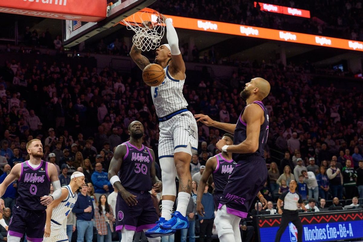 Mar 7, 2026; Minneapolis, Minnesota, USA; Orlando Magic forward Paolo Banchero (5) dunks on the Minnesota Timberwolves in the first quarter at Target Center. Mandatory Credit: Matt Blewett-Imagn Images