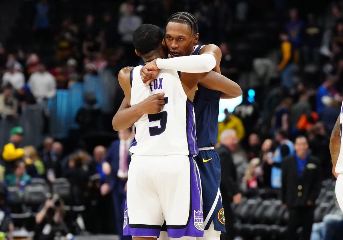 Feb 14, 2024; Denver, Colorado, USA; Sacramento Kings guard De'Aaron Fox (5) and Denver Nuggets forward Peyton Watson (8) following the game at Ball Arena.