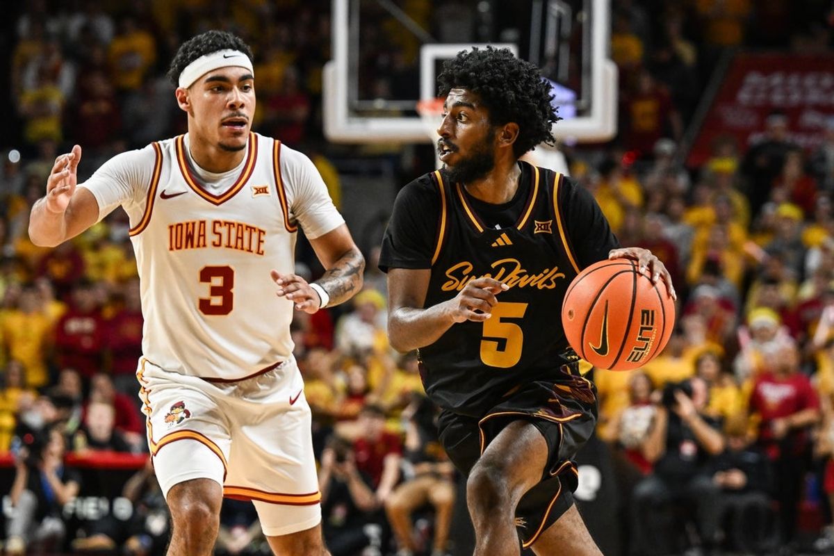 Mar 7, 2026; Ames, Iowa, USA; Arizona State Sun Devils guard Maurice Odum (5) is defended by Iowa State Cyclones guard Tamin Lipsey (3) during the second half at James H. Hilton Coliseum. Mandatory Credit: Jeffrey Becker-Imagn Images
