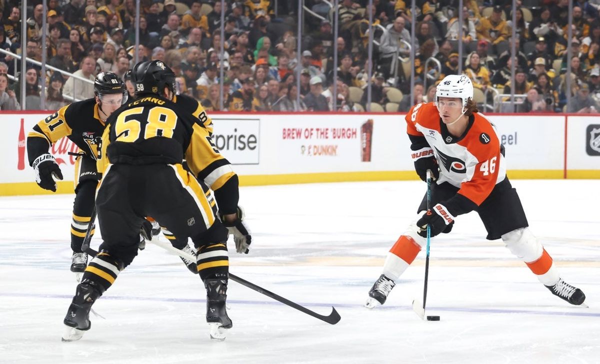 Mar 7, 2026; Pittsburgh, Pennsylvania, USA;  Philadelphia Flyers center Trevor Zegras (46) skates with the puck against Pittsburgh Penguins center Ben Kindel (81) and defenseman Kris Letang (58) during the first period at PPG Paints Arena. Mandatory Credit: Charles LeClaire-Imagn Images