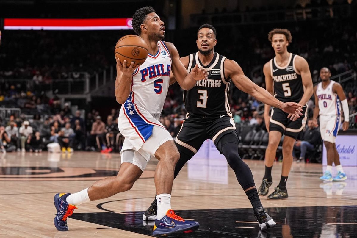 Mar 7, 2026; Atlanta, Georgia, USA; Philadelphia 76ers guard Quentin Grimes (5) drives to the basket against Atlanta Hawks guard CJ McCollum (3) during the first half at State Farm Arena. Mandatory Credit: Dale Zanine-Imagn Images