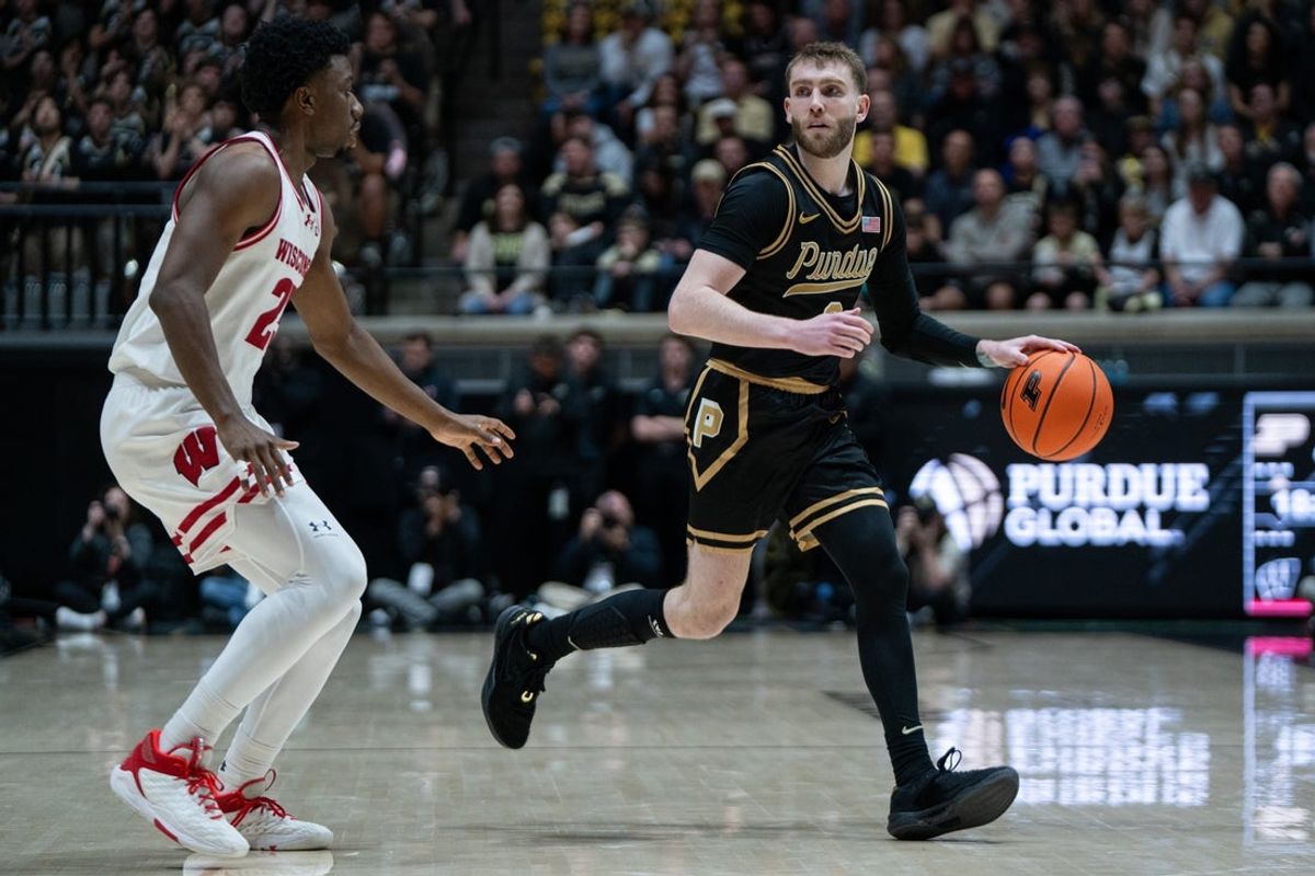 Mar 7, 2026; West Lafayette, Indiana, USA; Purdue Boilermakers guard Braden Smith (3) dribbles the ball around Wisconsin Badgers guard John Blackwell (25) during the second half at Mackey Arena. Mandatory Credit: Jacob Musselman-Imagn Images