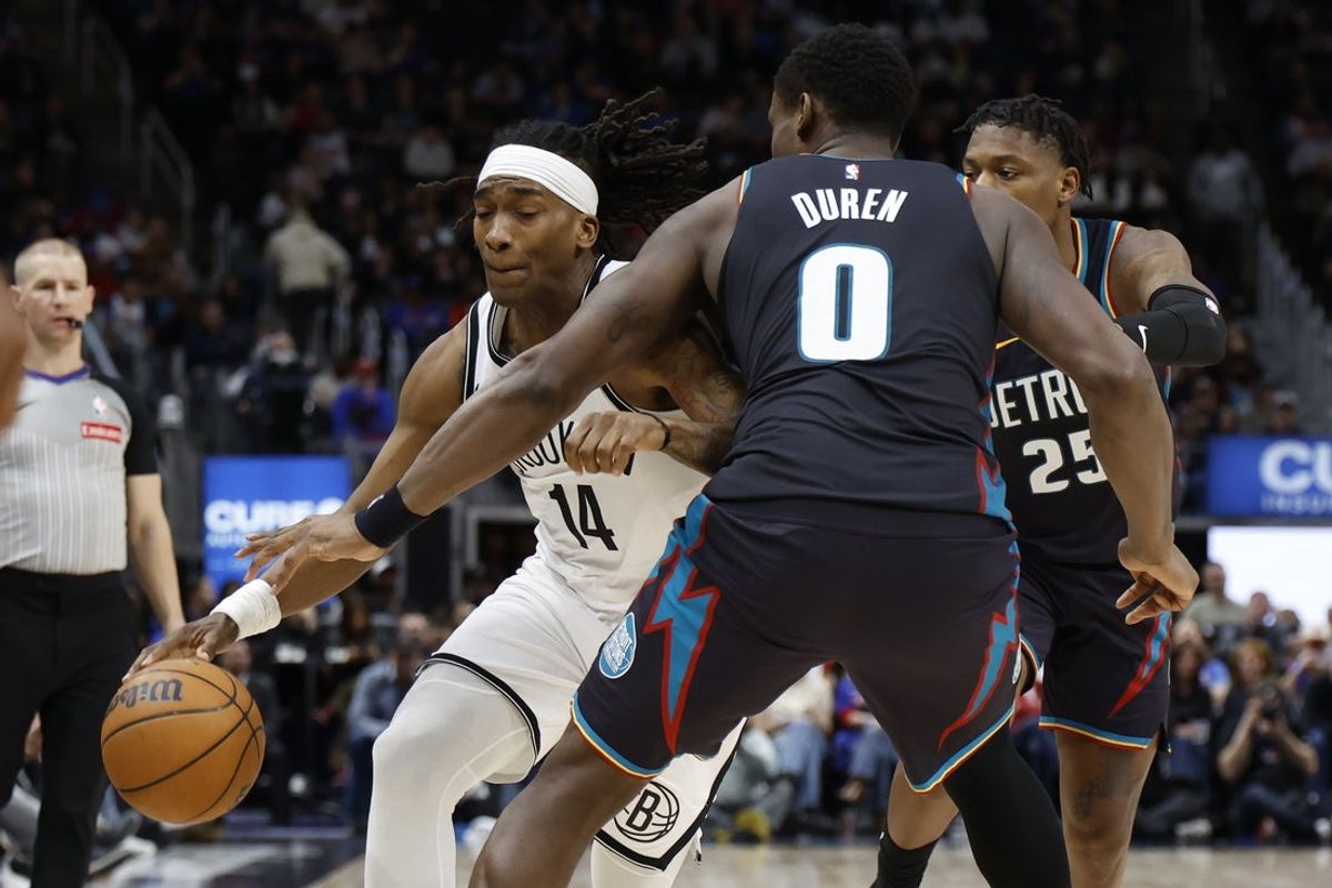Mar 7, 2026; Detroit, Michigan, USA;  Brooklyn Nets guard Terance Mann (14) dribbles defended by Detroit Pistons center Jalen Duren (0) in the first half at Little Caesars Arena. Mandatory Credit: Rick Osentoski-Imagn Images