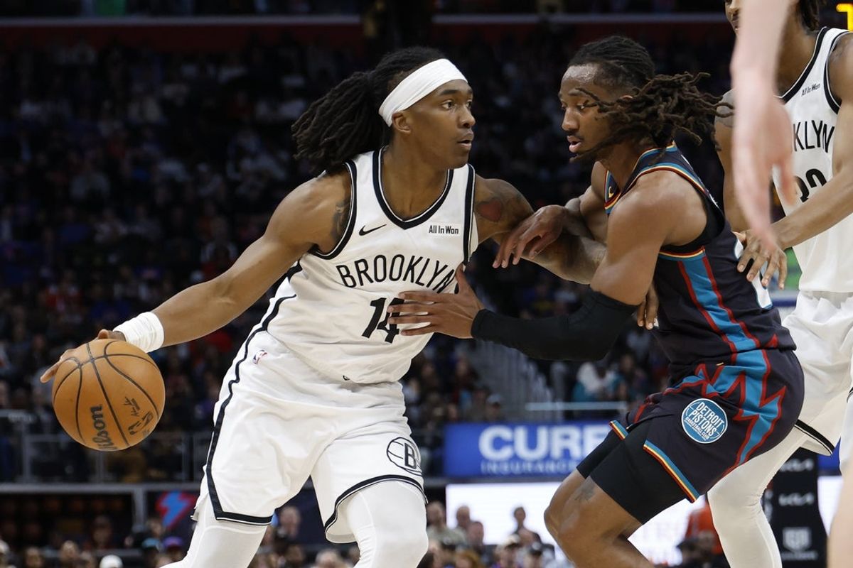 Mar 7, 2026; Detroit, Michigan, USA;  Brooklyn Nets guard Terance Mann (14) dribbles defended by Detroit Pistons guard Daniss Jenkins (24) in the first half at Little Caesars Arena. Mandatory Credit: Rick Osentoski-Imagn Images