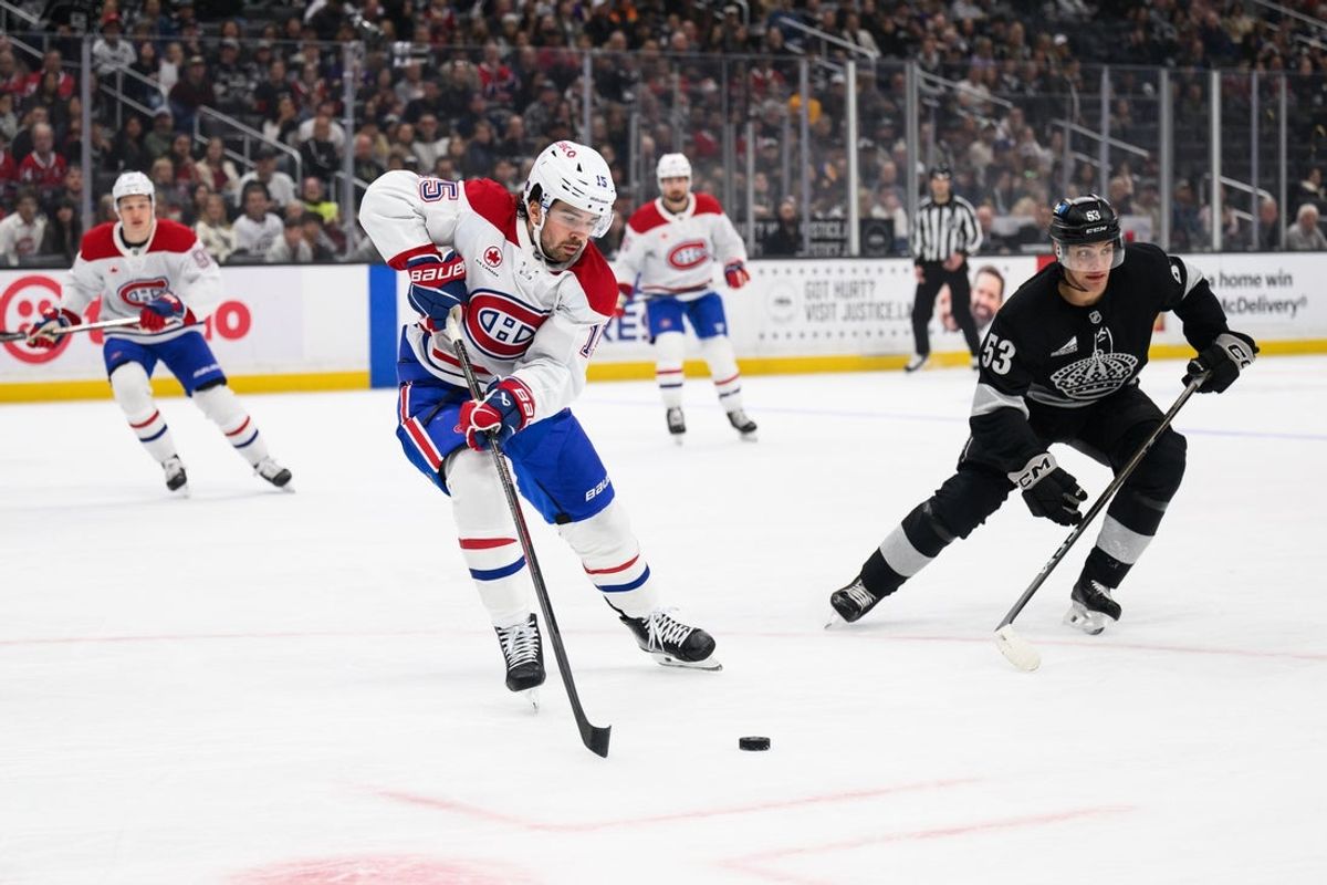 Mar 7, 2026; Los Angeles, California, USA; Montréal Canadiens center Alex Newhook (15) controls the puck during the first period against the Los Angeles Kings at Crypto.com Arena. Mandatory Credit: William Liang-Imagn Images
