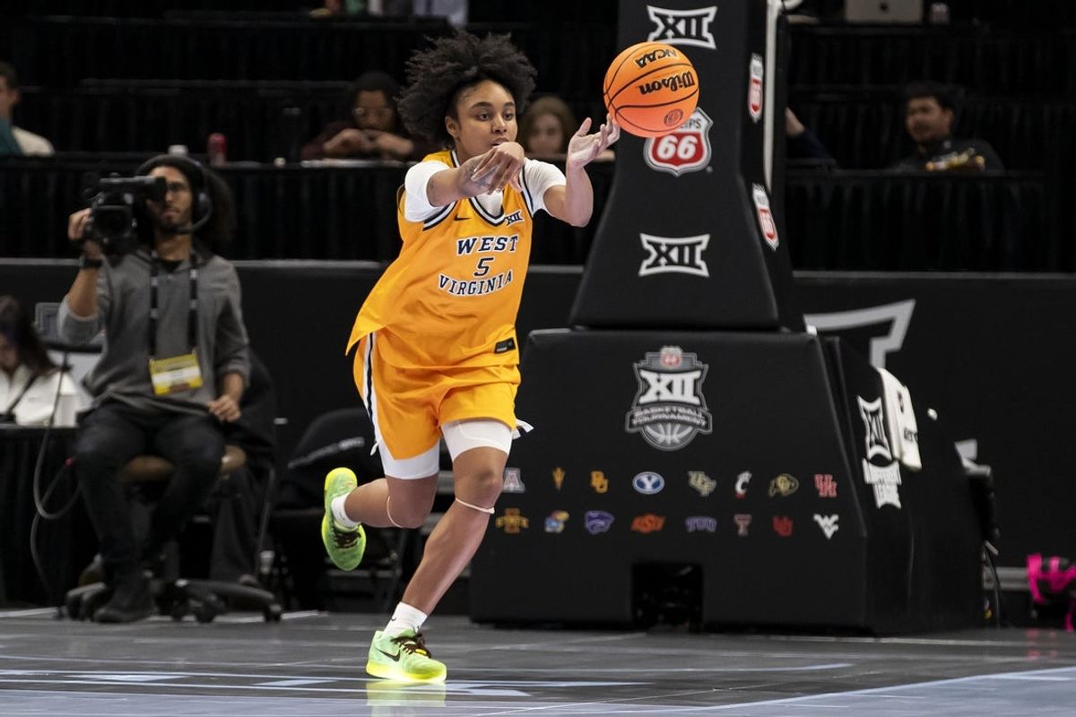 Mar 7, 2026; Kansas City, MO, USA;  West Virginia Mountaineers guard Sydney Shaw (5) passes the ball against the Colorado Buffaloes during the second half at T-Mobile Center. Mandatory Credit: Nick Tre. Smith-Imagn Images