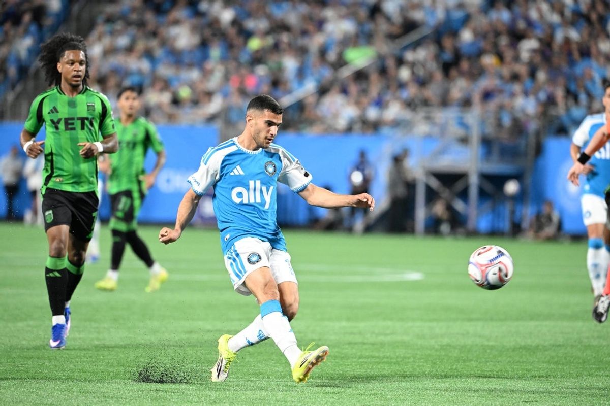 Mar 7, 2026; Charlotte, North Carolina, USA;  Charlotte FC forward Liel Abada (11) shoots as Austin FC forward Jayden Nelson (7) defends in the first half at Bank of America Stadium. Mandatory Credit: Bob Donnan-Imagn Images