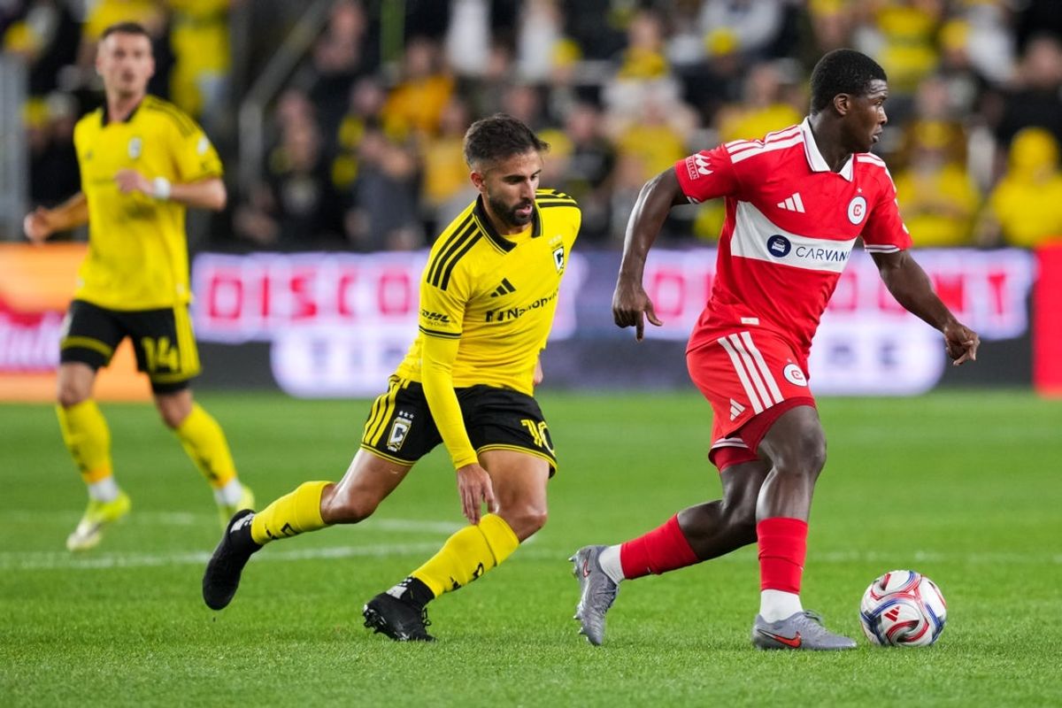 Mar 7, 2026; Columbus, Ohio, USA;  Chicago Fire defender Mbekezeli Mbokazi (4) dribbles the ball against Columbus Crew forward Diego Rossi (10) in the first half at ScottsMiracle-Gro Field. Mandatory Credit: Aaron Doster-Imagn Images