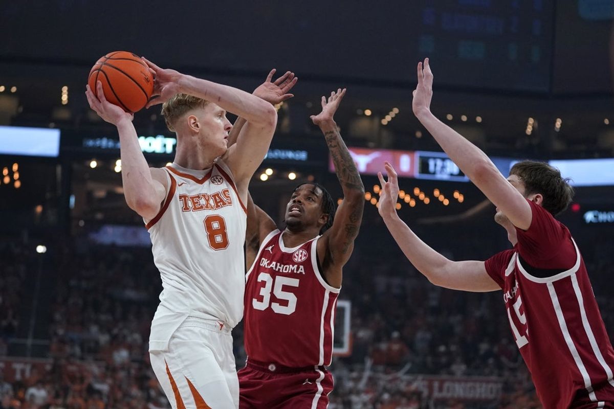 Mar 7, 2026; Austin, Texas, USA; Texas Longhorns center Matas Vokietaitis (8) looks to pass againats Oklahoma Sooners forward Derrion Reid (35) and center Kirill Elatontsev (15) during the first half at Moody Center. Mandatory Credit: Dustin Safranek-Imagn Images