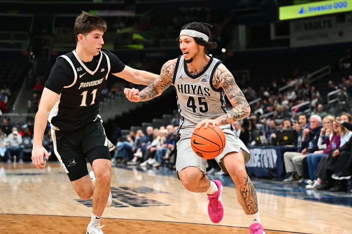 Mar 7, 2026; Washington, District of Columbia, USA; Georgetown Hoyas guard Kayvaun Mulready (45) dribbles as Providence Friars guard Ryan Mela (11) defends during the first half at Capital One Arena. Mandatory Credit: Brad Mills-Imagn Images