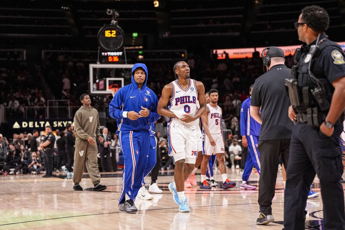 Mar 7, 2026; Atlanta, Georgia, USA; Philadelphia 76ers guard Tyrese Maxey (0) reacts and is assisted after being injured against the Atlanta Hawks during the second half at State Farm Arena. Mandatory Credit: Dale Zanine-Imagn Images