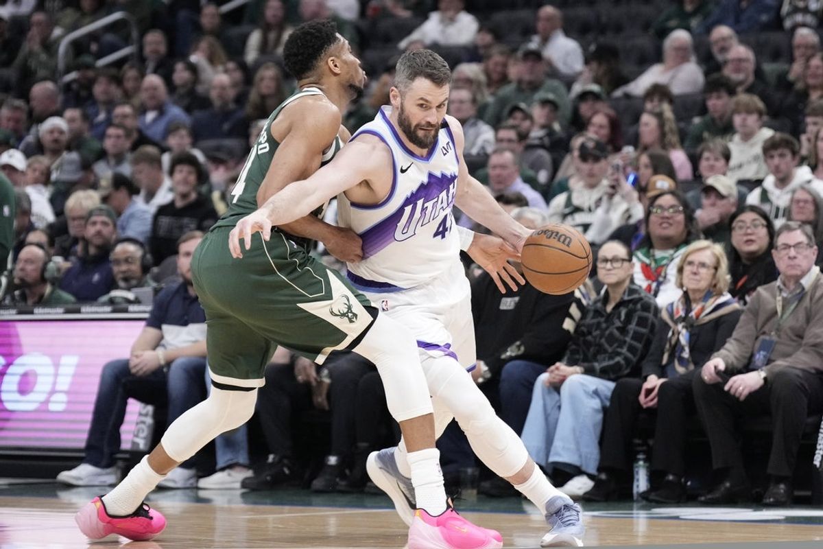 Mar 7, 2026; Milwaukee, Wisconsin, USA; Utah Jazz forward Blake Hinson (2) drives against Milwaukee Bucks forward Giannis Antetokounmpo (34) in the first half at Fiserv Forum. Mandatory Credit: Michael McLoone-Imagn Images