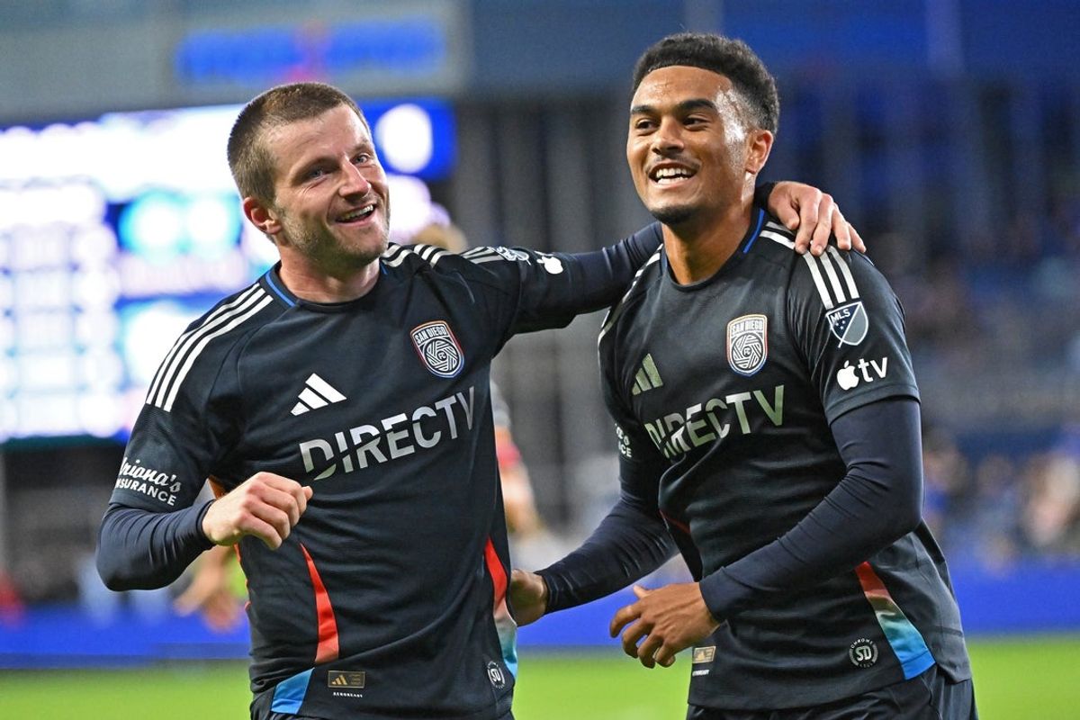Mar 7, 2026; Kansas City, Kansas, USA;  San Diego FC midfielder Anders Dreyer (left) celebrates after scoring a goal with teammate San Diego FC midfielder Pedro Soma (right) in the first half against Sporting Kansas City at Sporting Park. Mandatory Credit: Peter Aiken-Imagn Images