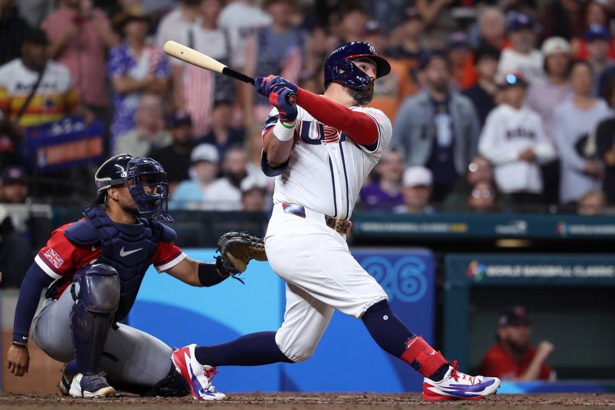 Mar 7, 2026; Houston, TX, United States; United States designated hitter Kyle Schwarber (12) hits a two-run home run against Great Britain during the fifth inning at Daikin Park. Mandatory Credit: Troy Taormina-Imagn Images