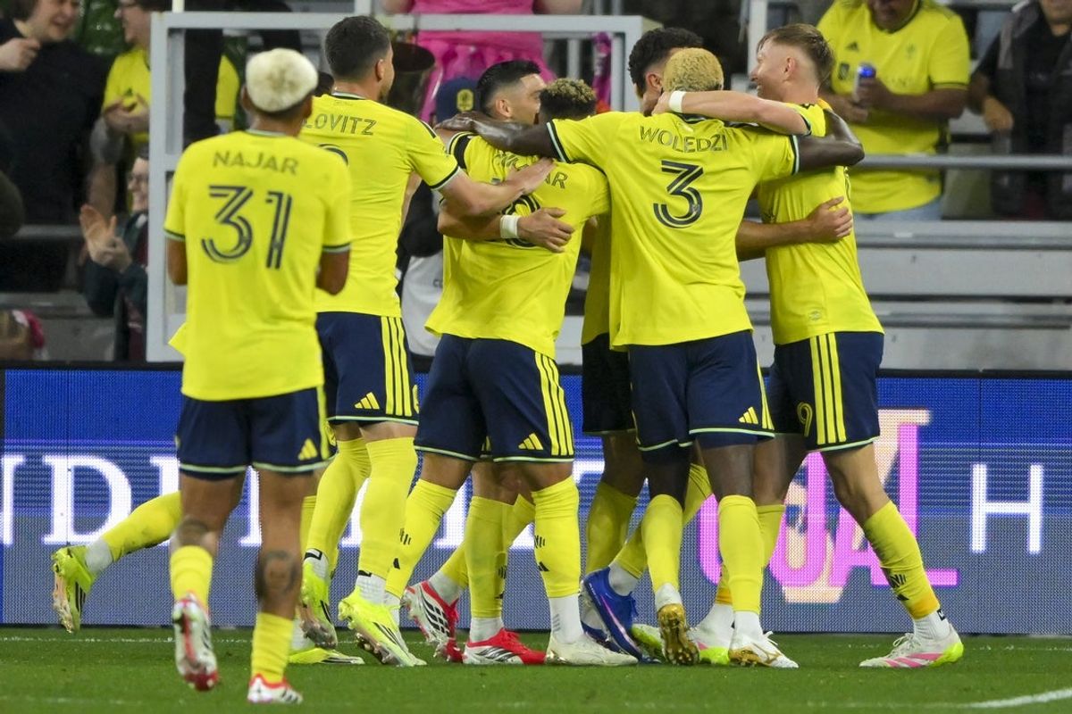 Mar 7, 2026; Nashville, Tennessee, USA;  Nashville SC midfielder Patrick Yazbek (8) celebrates with his teammates after scoring a goal against the Minnesota United FC during the first half at Geodis Park. Mandatory Credit: Steve Roberts-Imagn Images