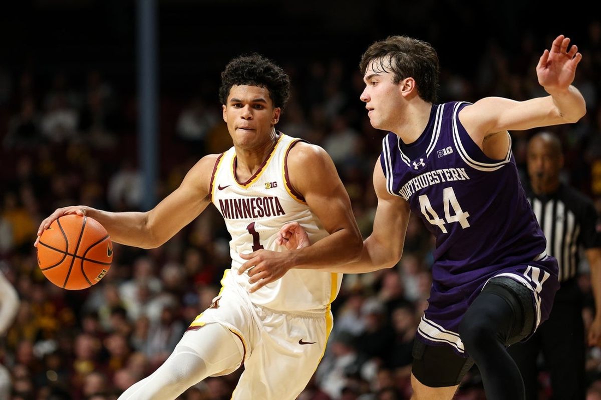 Mar 7, 2026; Minneapolis, Minnesota, USA; Minnesota Golden Gophers guard Isaac Asuma (1) works around Northwestern Wildcats guard Angelo Ciaravino (44) during the first half at Williams Arena. Mandatory Credit: Matt Krohn-Imagn Images