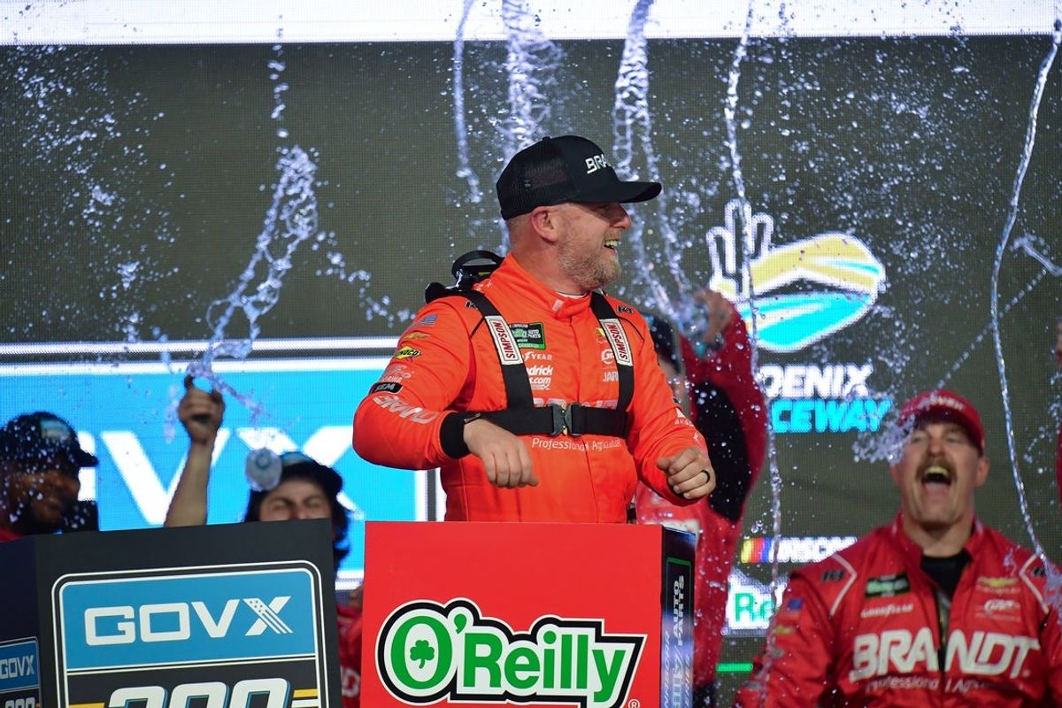 Mar 7, 2026; Avondale, Arizona, USA; JR Motorsports driver Justin Allgaier (7) celebrates his victory of the GOVX 200 at Phoenix Raceway. Mandatory Credit: Gary A. Vasquez-Imagn Images