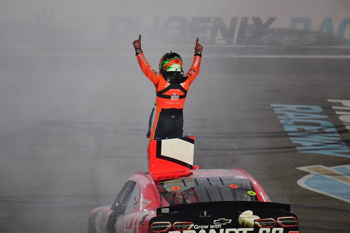 Mar 7, 2026; Avondale, Arizona, USA; JR Motorsports driver Justin Allgaier (7) celebrates his victory of the the GOVX 200 at Phoenix Raceway. Mandatory Credit: Gary A. Vasquez-Imagn Images
