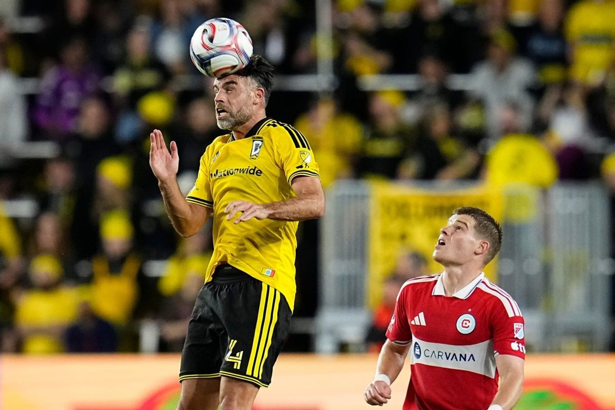 Columbus Crew defender Rudy Camacho (4) heads a ball over Chicago Fire forward Chris Mueller (8) during the second half of the MLS match at ScottsMiracle-Gro Field in Columbus on March 7, 2026. The teams tied 0-0.