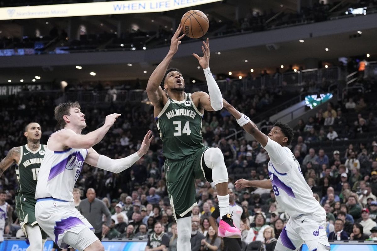 Mar 7, 2026; Milwaukee, Wisconsin, USA; Milwaukee Bucks forward Giannis Antetokounmpo (34) drives to the basket against Utah Jazz forward Ace Bailey (19) in the second half at Fiserv Forum. Mandatory Credit: Michael McLoone-Imagn Images