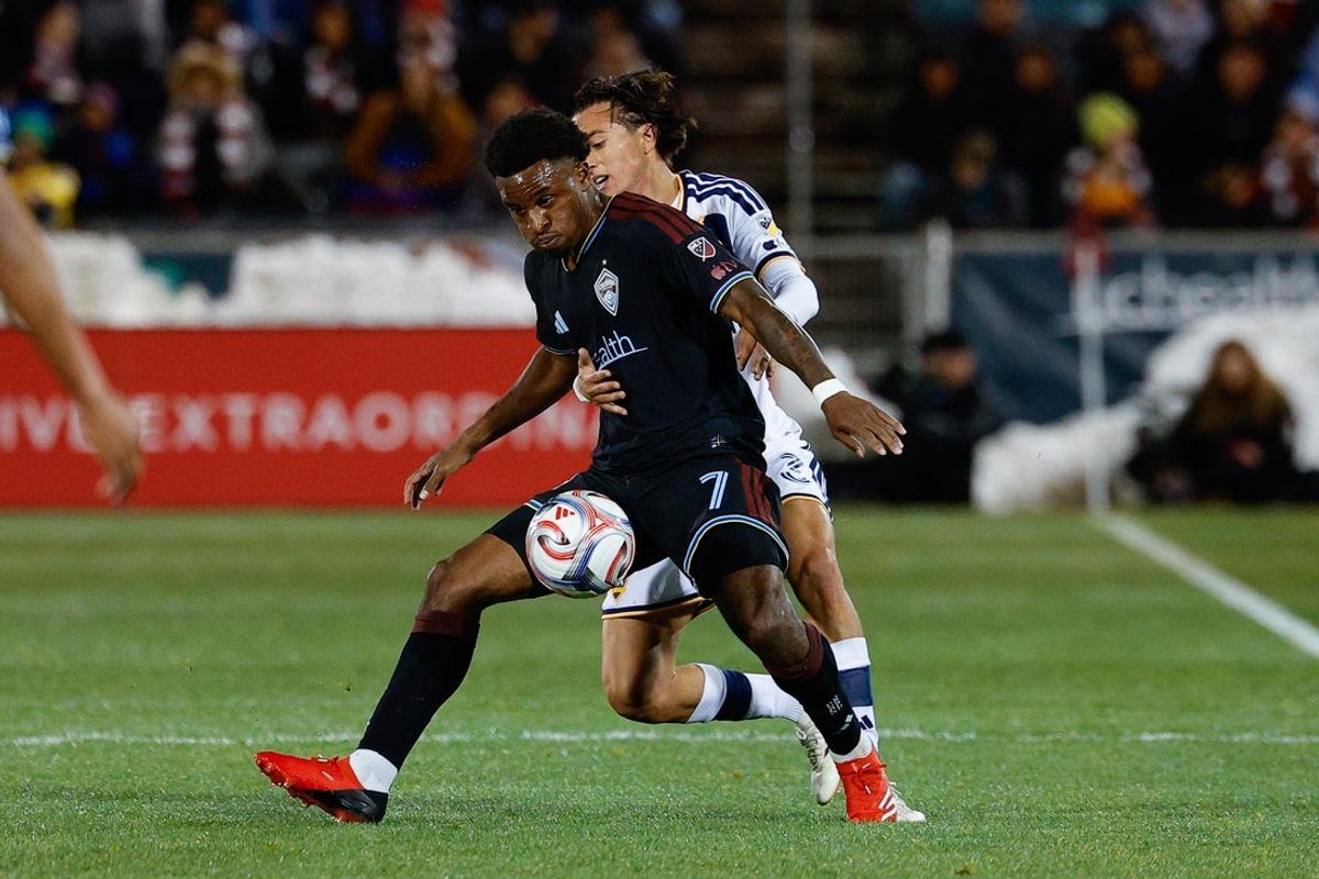 Mar 7, 2026; Commerce City, Colorado, USA; Colorado Rapids forward Dante Sealy (7) and LA Galaxy defender Julian Aude (3) battle for the ball in the first half at Dick's Sporting Goods Park. Mandatory Credit: Isaiah J. Downing-Imagn Images