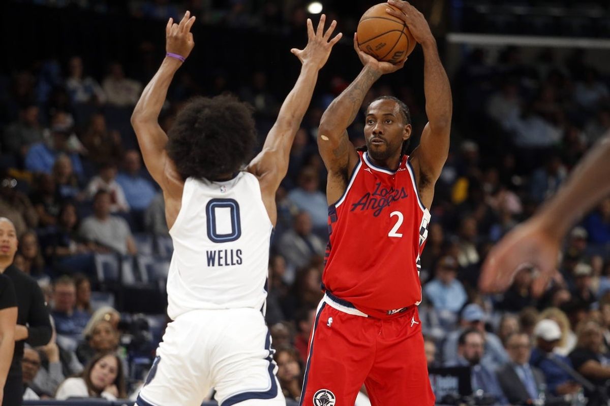 Mar 7, 2026; Memphis, Tennessee, USA; Los Angeles Clippers forward Kawhi Leonard (2) shoots for three as Memphis Grizzlies forward Jaylen Wells (0) defends during the third quarter at FedExForum. Mandatory Credit: Petre Thomas-Imagn Images