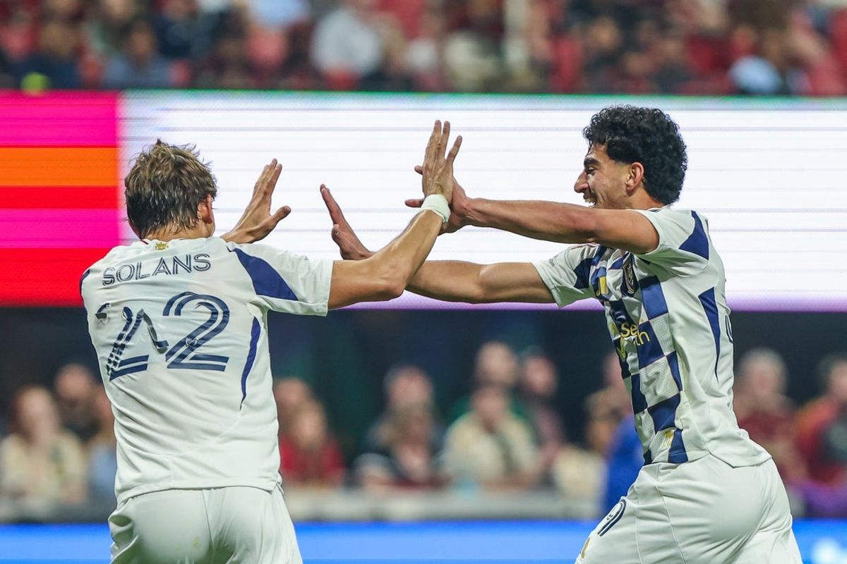 Mar 7, 2026; Atlanta, Georgia, USA; Real Salt Lake forward Sergi Solans (22) and forward Aiden Hezarkhani (39) celebrate a goal against the Atlanta United during the first half at Mercedes-Benz Stadium. Mandatory Credit: Jordan Godfree-Imagn Images