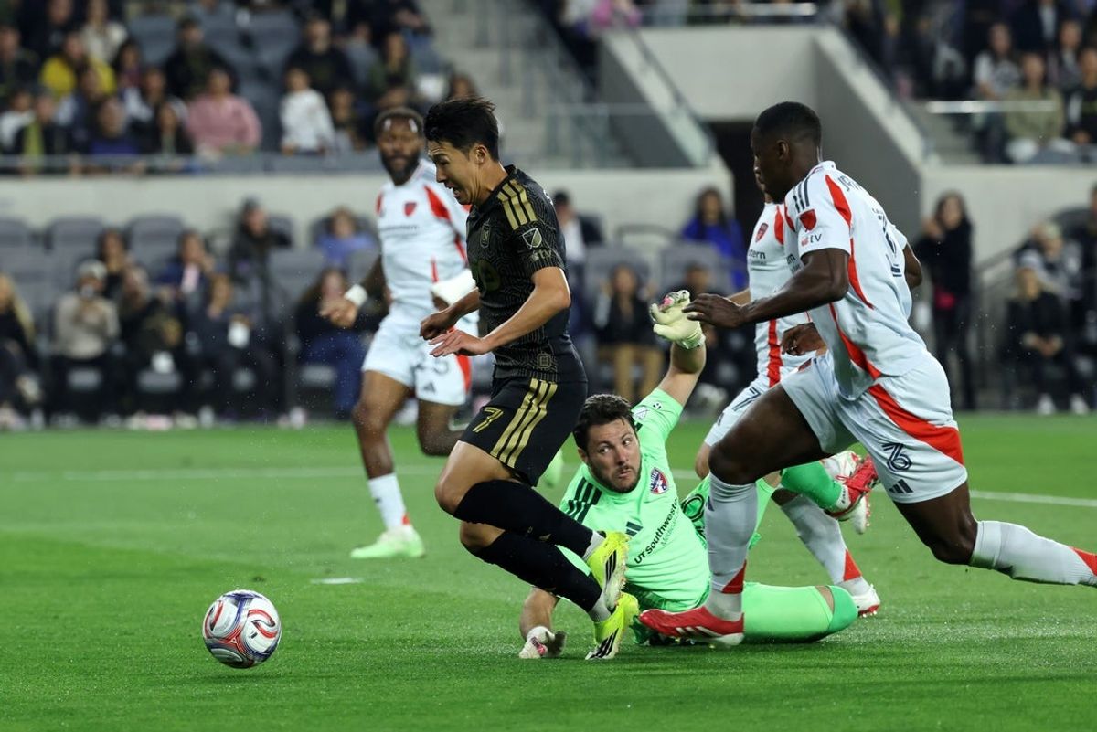 Mar 7, 2026; Los Angeles, California, USA;   LAFC forward Son Heung-Min (7) attacks the goal past FC Dallas goalkeeper Michael Collodi (30) and defender Osaze Urhoghide (3) during the first half at BMO Stadium. Mandatory Credit: Kiyoshi Mio-Imagn Images