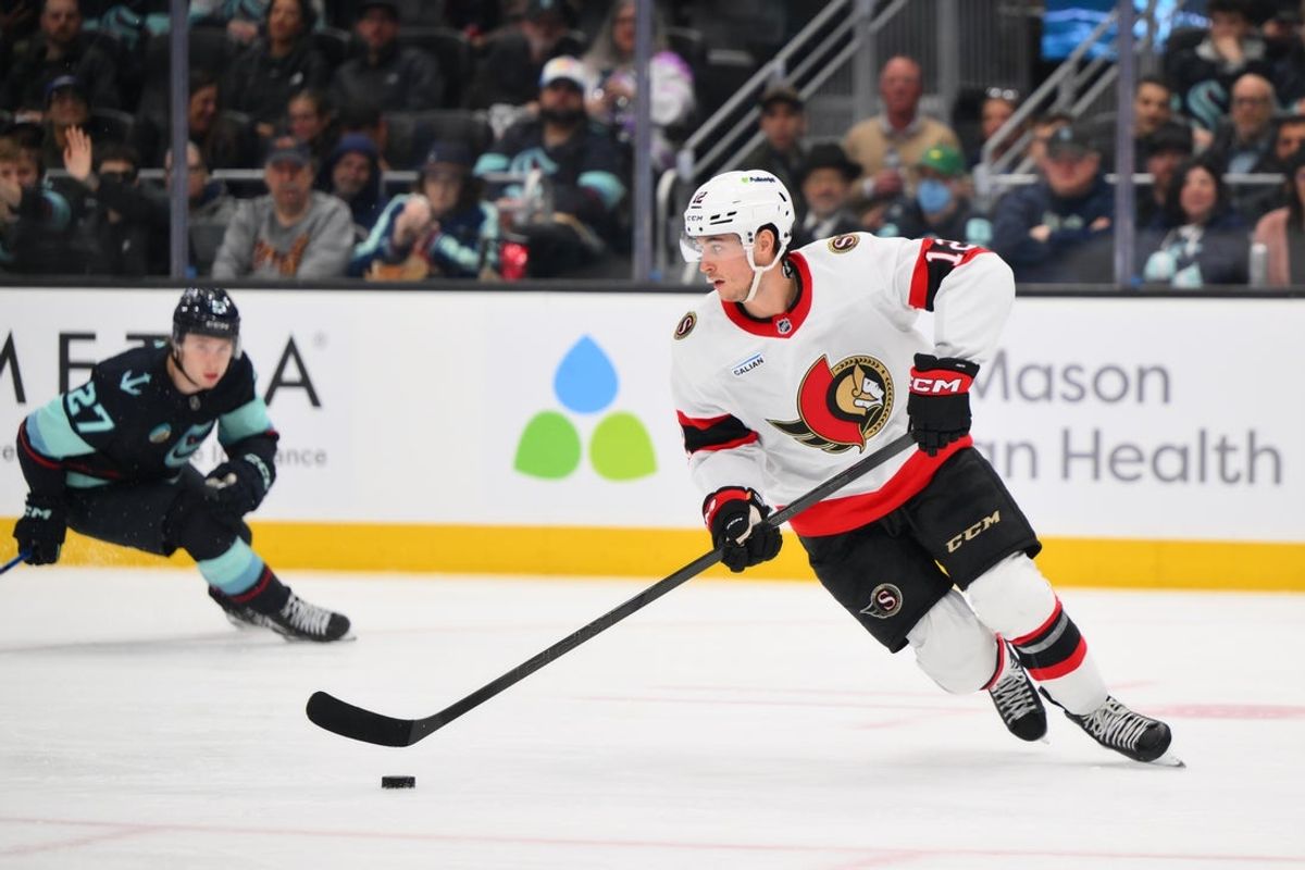 Mar 7, 2026; Seattle, Washington, USA; Ottawa Senators center Shane Pinto (12) plays the puck during the second period against the Seattle Kraken at Climate Pledge Arena. Mandatory Credit: Steven Bisig-Imagn Images