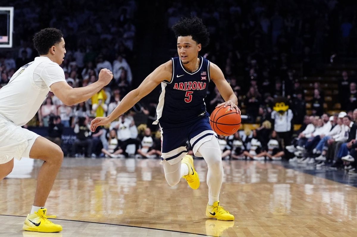 Mar 7, 2026; Boulder, Colorado, USA; Arizona Wildcats guard Brayden Burries (5) controls the ball in the first half against the Colorado Buffaloes at the CU Events Center. Mandatory Credit: Ron Chenoy-Imagn Images