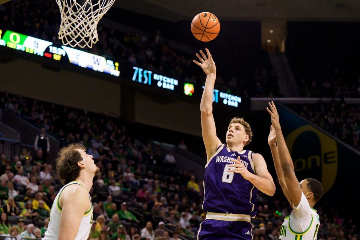 Washington forward Hannes Steinbach, center, goes up for a shot as the Oregon Ducks host the Washington Huskies on March 7, 2026, at Matthew Knight Arena in Eugene, Oregon.