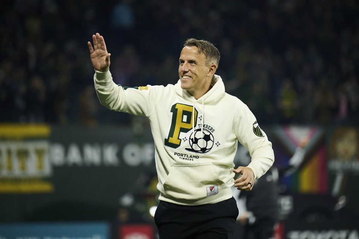 Mar 7, 2026; Portland, Oregon, USA; Portland Timbers manager Phil Neville waves to fans before a game against the Vancouver Whitecaps at Providence Park. Mandatory Credit: Troy Wayrynen-Imagn Images