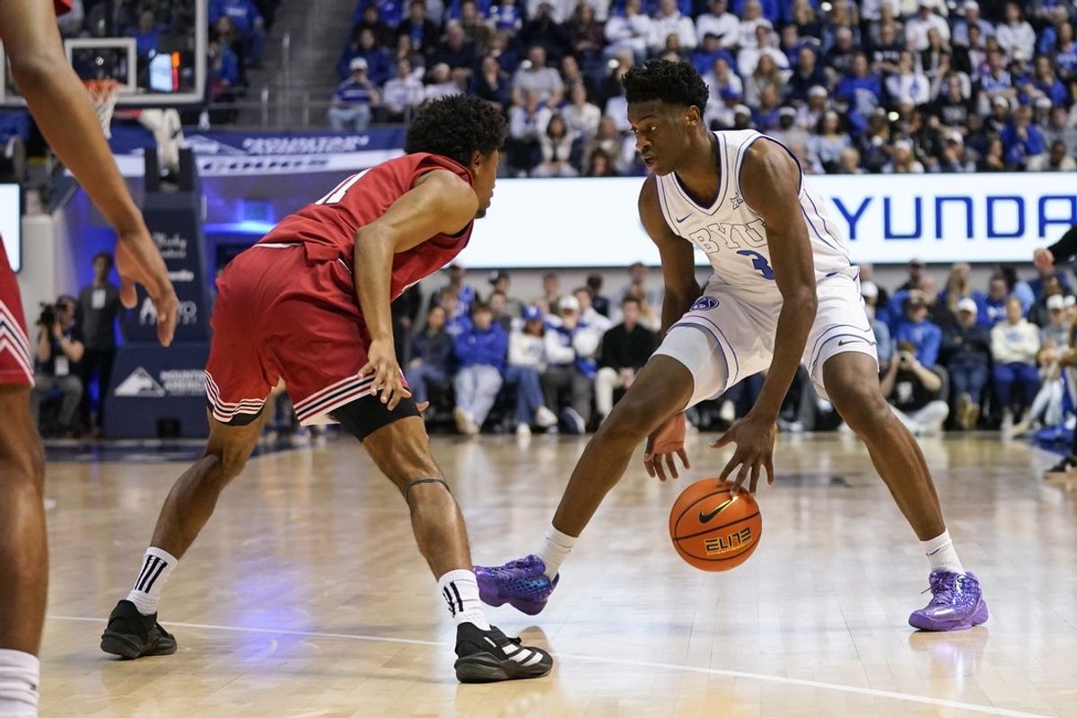 Mar 7, 2026; Provo, Utah, USA; BYU Cougars forward AJ Dybantsa (3) dribbles the ball while being defended by Texas Tech Red Raiders guard Jaylen Petty (11) during the first half at Marriott Center. Mandatory Credit: Aaron Baker-Imagn Images