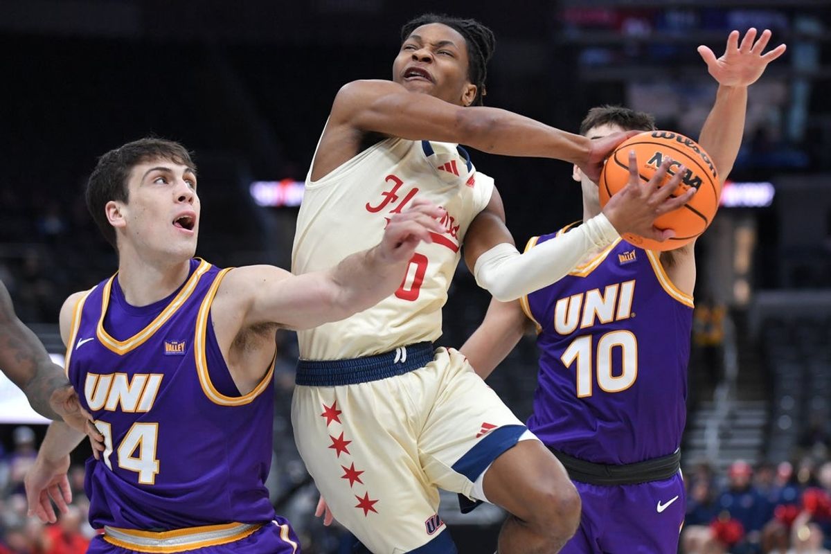 Mar 8, 2026; St. Louis, MO, USA;  UIC Flames guard Ahmad Henderson II (0) drives between Northern Iowa Panthers forward Tristan Smith (14) and  RJ Taylor (10) during the first half at Enterprise Center. Mandatory Credit: Ron Johnson-Imagn Images