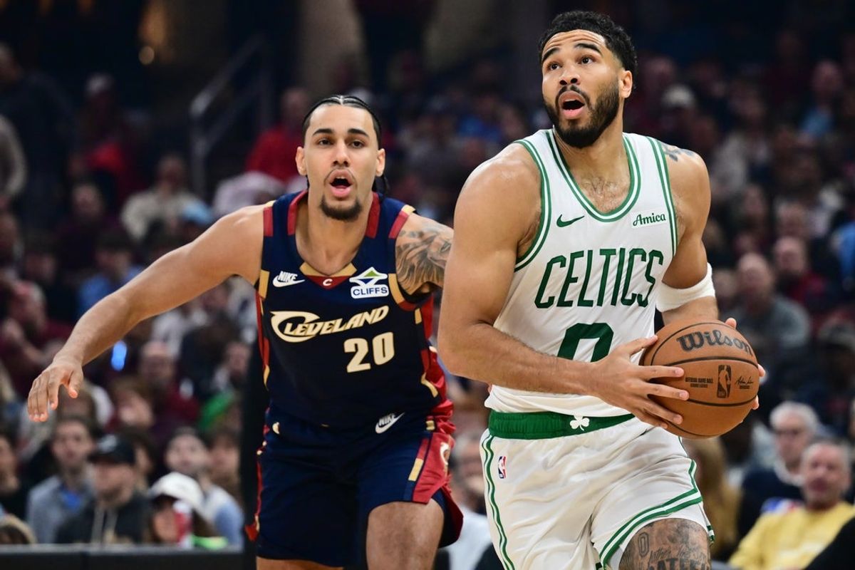 Mar 8, 2026; Cleveland, Ohio, USA; Boston Celtics forward Jayson Tatum (0) drives to the basket against Cleveland Cavaliers guard Jaylon Tyson (20) during the first half at Rocket Arena. Mandatory Credit: Ken Blaze-Imagn Images