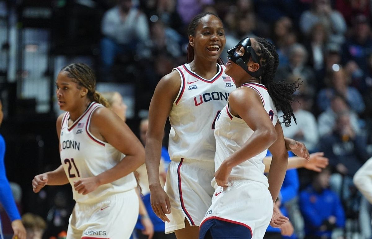 Mar 8, 2026; Uncasville, CT, USA; UConn Huskies guard Kk Arnold (2) reacts with forward Blanca Quiñonez (4) after her basket against the Creighton Bluejays in the first half at Mohegan Sun Arena. Mandatory Credit: David Butler II-Imagn Images