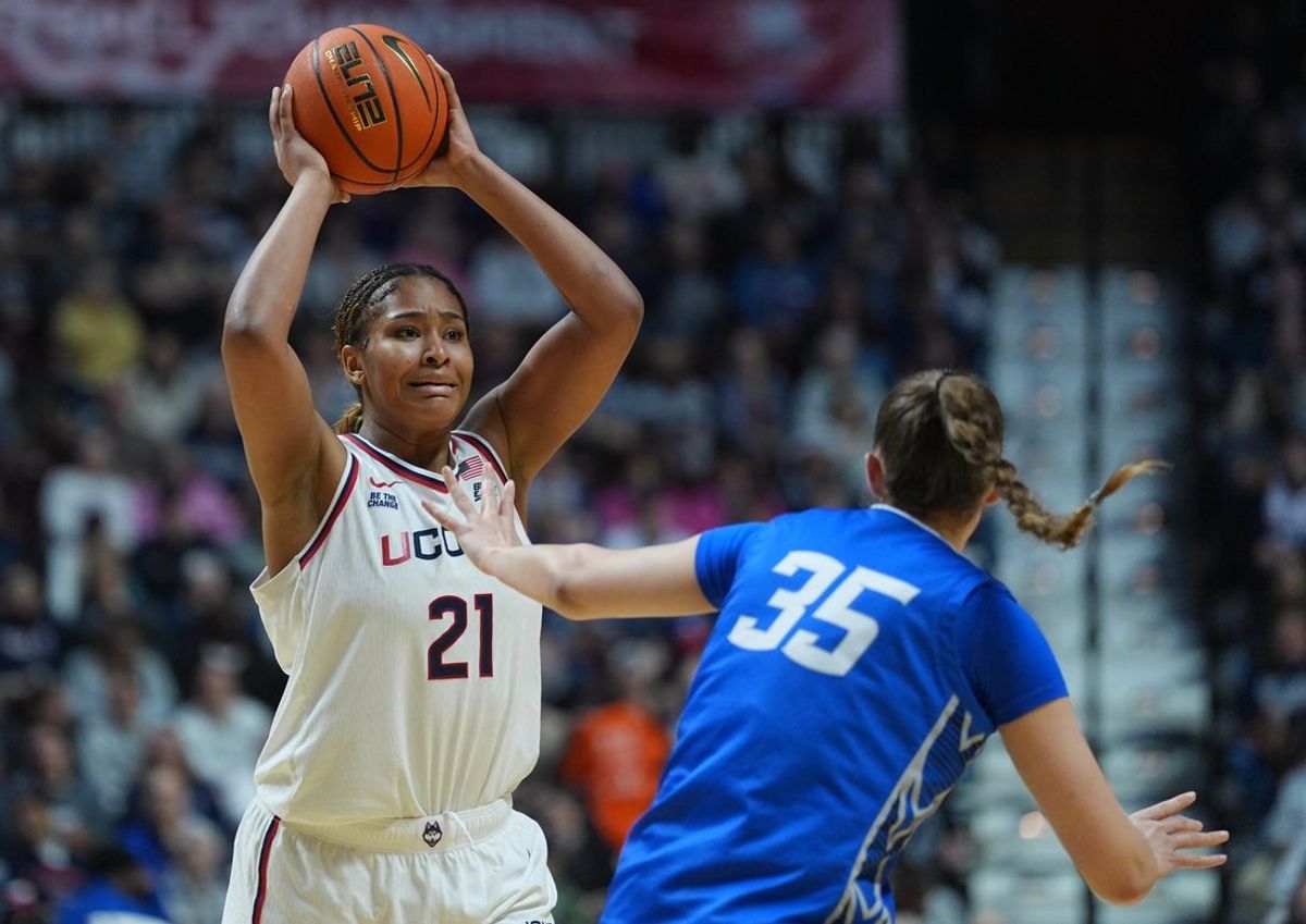Mar 8, 2026; Uncasville, CT, USA; UConn Huskies forward Sarah Strong (21) looks to pass the ball against Creighton Bluejays center Elizabeth Gentry (35) in the second half at Mohegan Sun Arena. Mandatory Credit: David Butler II-Imagn Images
