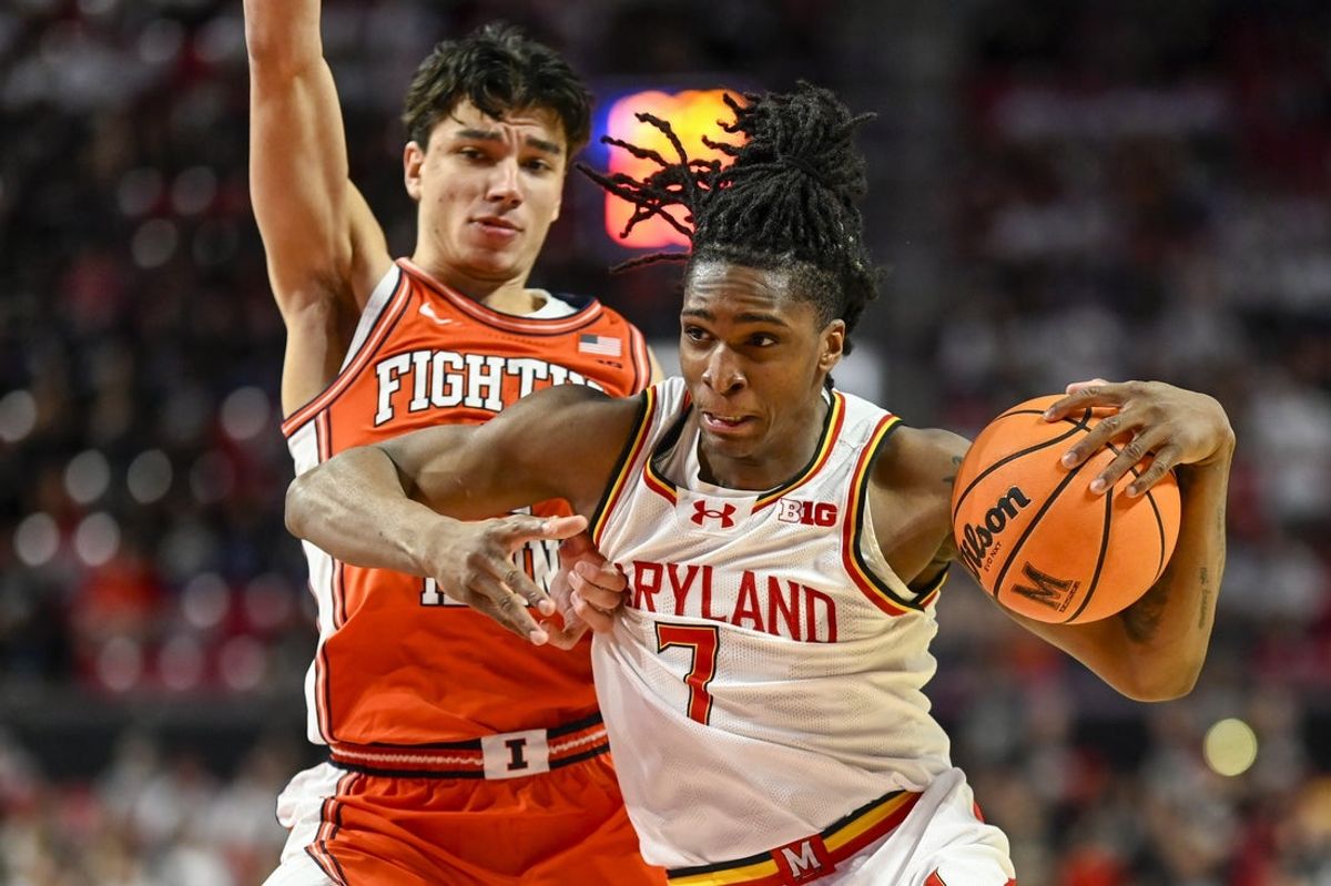 Mar 8, 2026; College Park, Maryland, USA;  Maryland Terrapins guard Andre Mills (7) dribbles by Illinois Fighting Illini guard Andrej Stojakovic (2) during the second  half at Xfinity Center. Mandatory Credit: Tommy Gilligan-Imagn Images